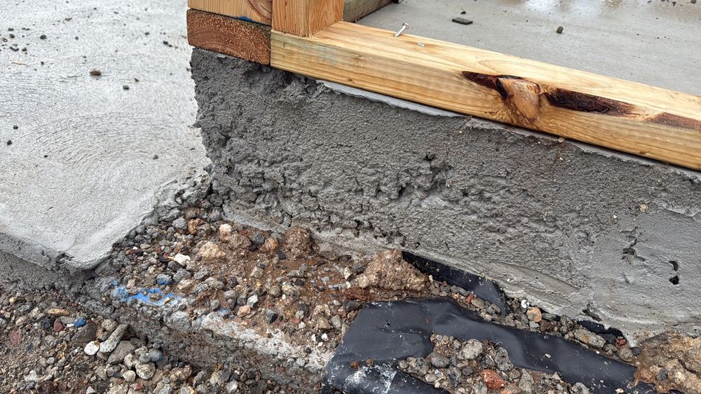 Honeycombed concrete along the slab edge, open voids that weaken it and let water in, found during a frame inspection in Werribee