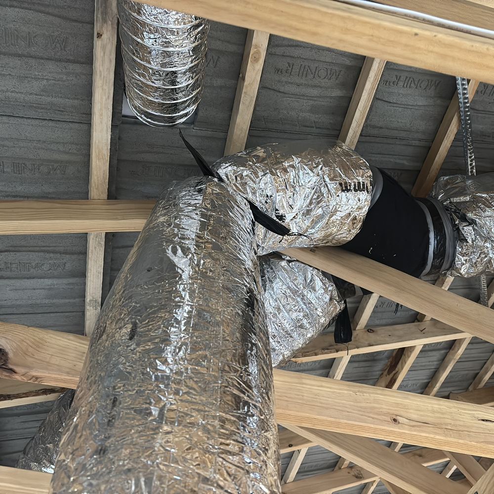 Heating ducts crimped and tightly bent in the roof, choking airflow to rooms, found during a lock-up inspection in Werribee