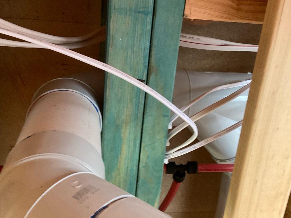 Sewer junction placed inside the 450mm clear zone meant to prevent blockages, found during a lock-up inspection in Werribee