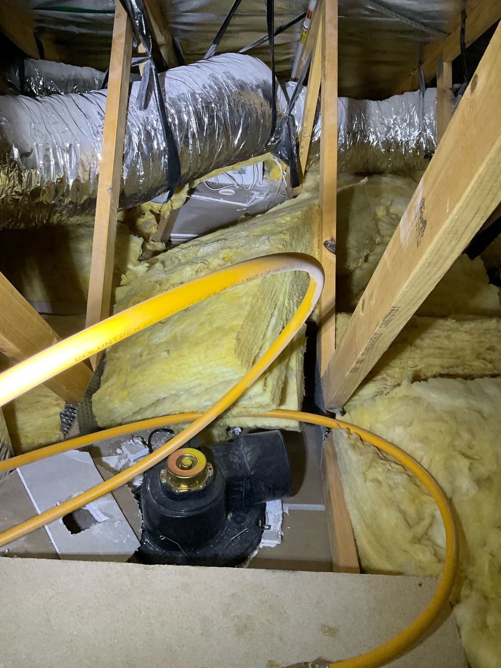 Exhaust fan discharging into the roof space rather than ducted outside, found during a pre-handover inspection in Werribee