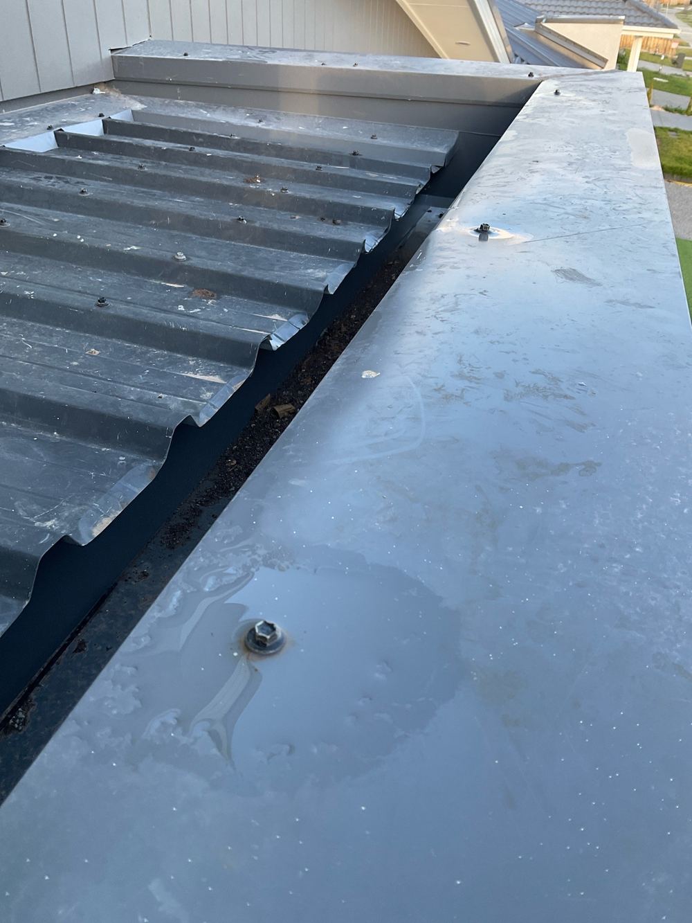 Wall cappings screwed through the top, where water can follow the fixings in, found during a pre-handover inspection in Werribee
