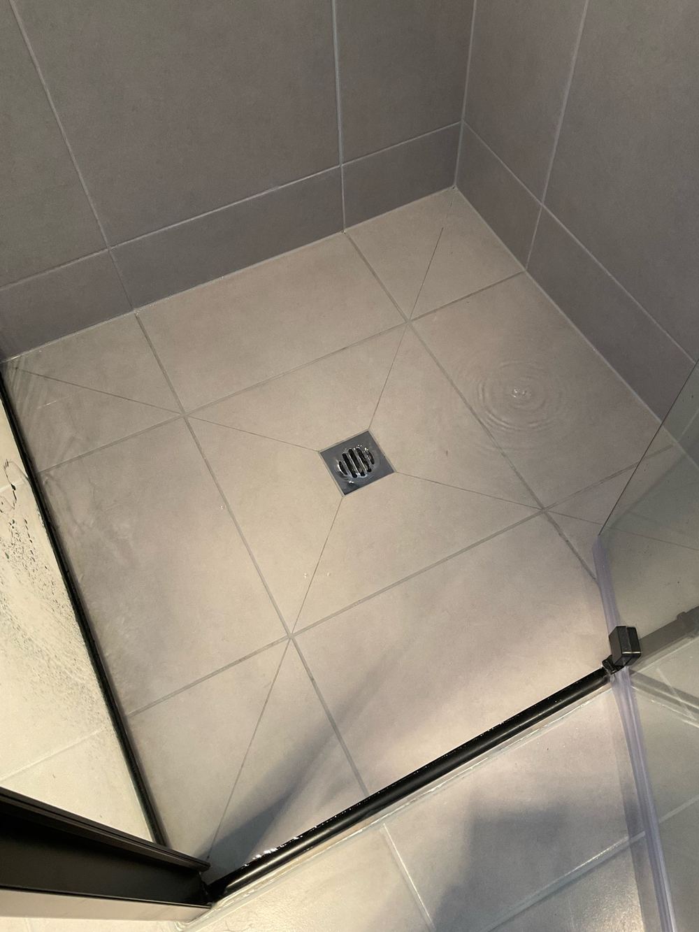 Shower that drains too slowly and leaves water ponding, found during a pre-handover inspection in Werribee