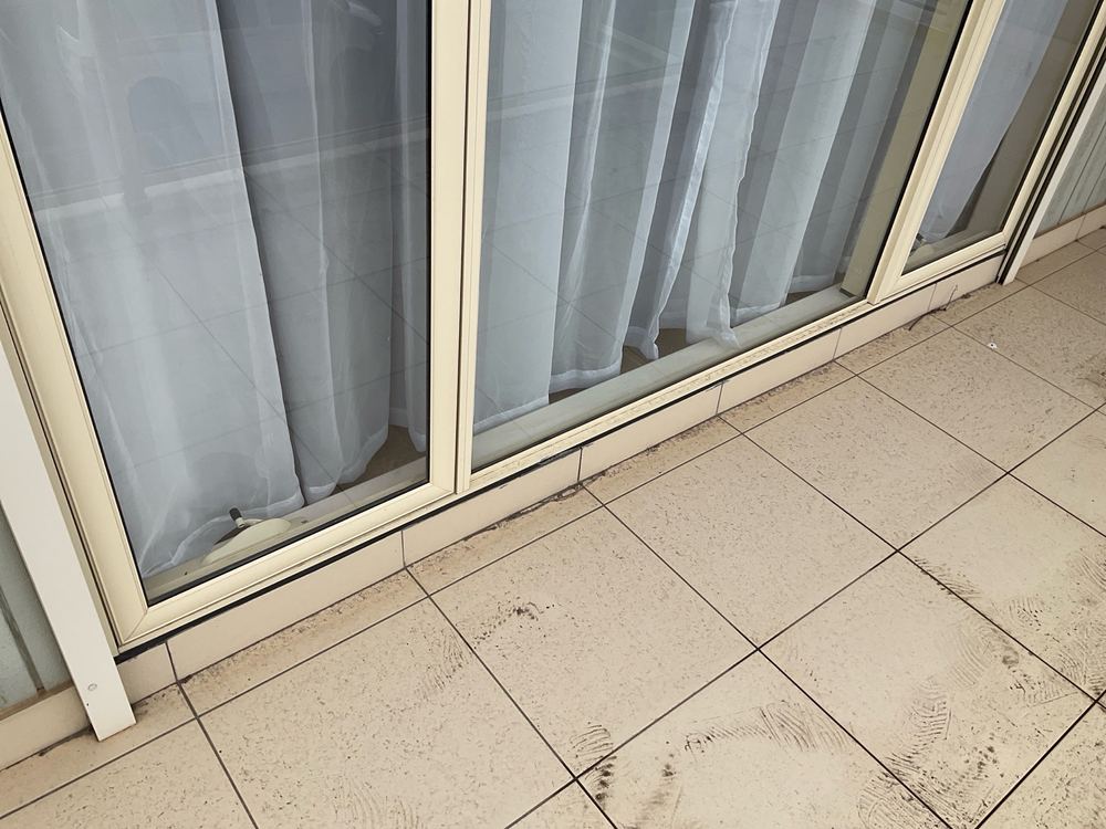 Drummy tiles with open gaps where wind driven rain can get in, found during a pre-purchase inspection in Sunshine North