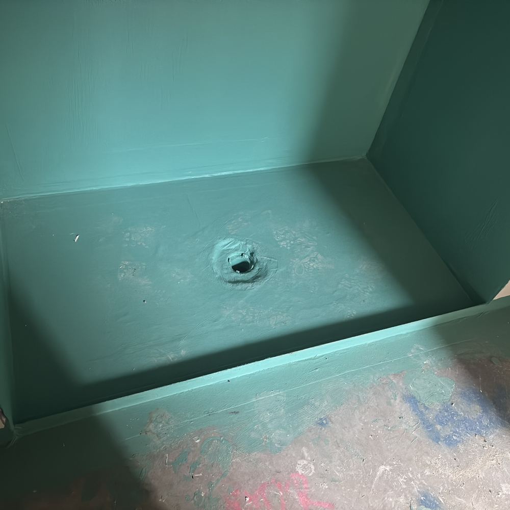 Finished membrane left exposed to boots and tools before tiling, found during a waterproofing inspection in Werribee